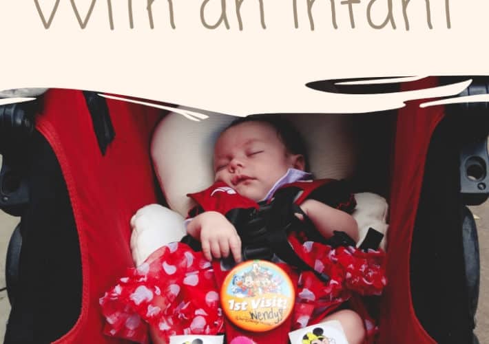 infant in red stroller with caption reading Walt Disney World with an infant