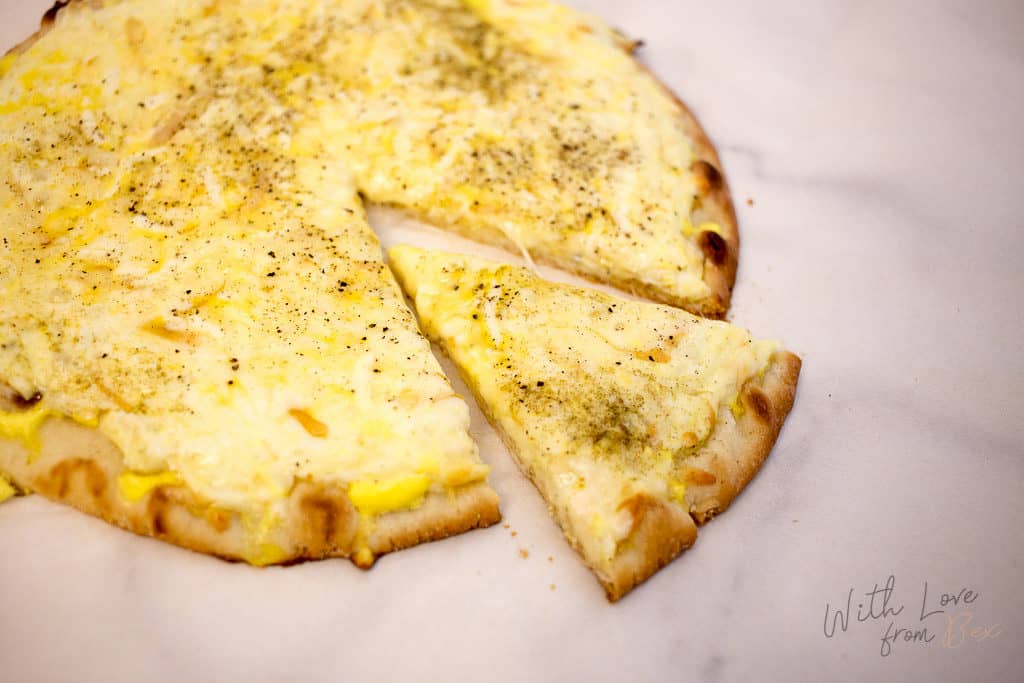 Pizza shell with egg and cheese topping