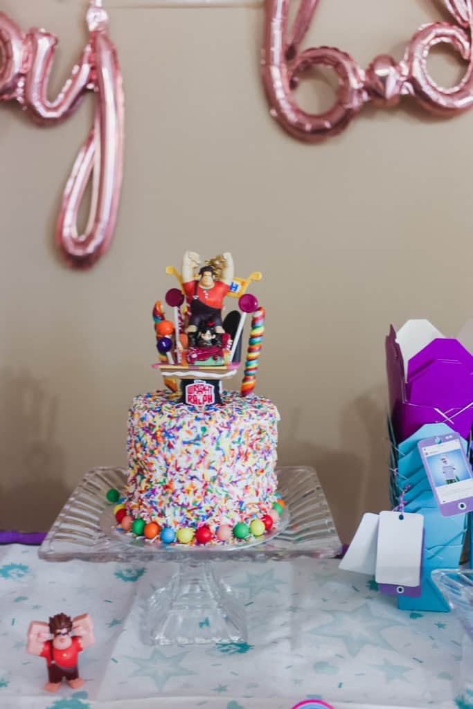 sprinkle cake with wreck it ralph figure on top
